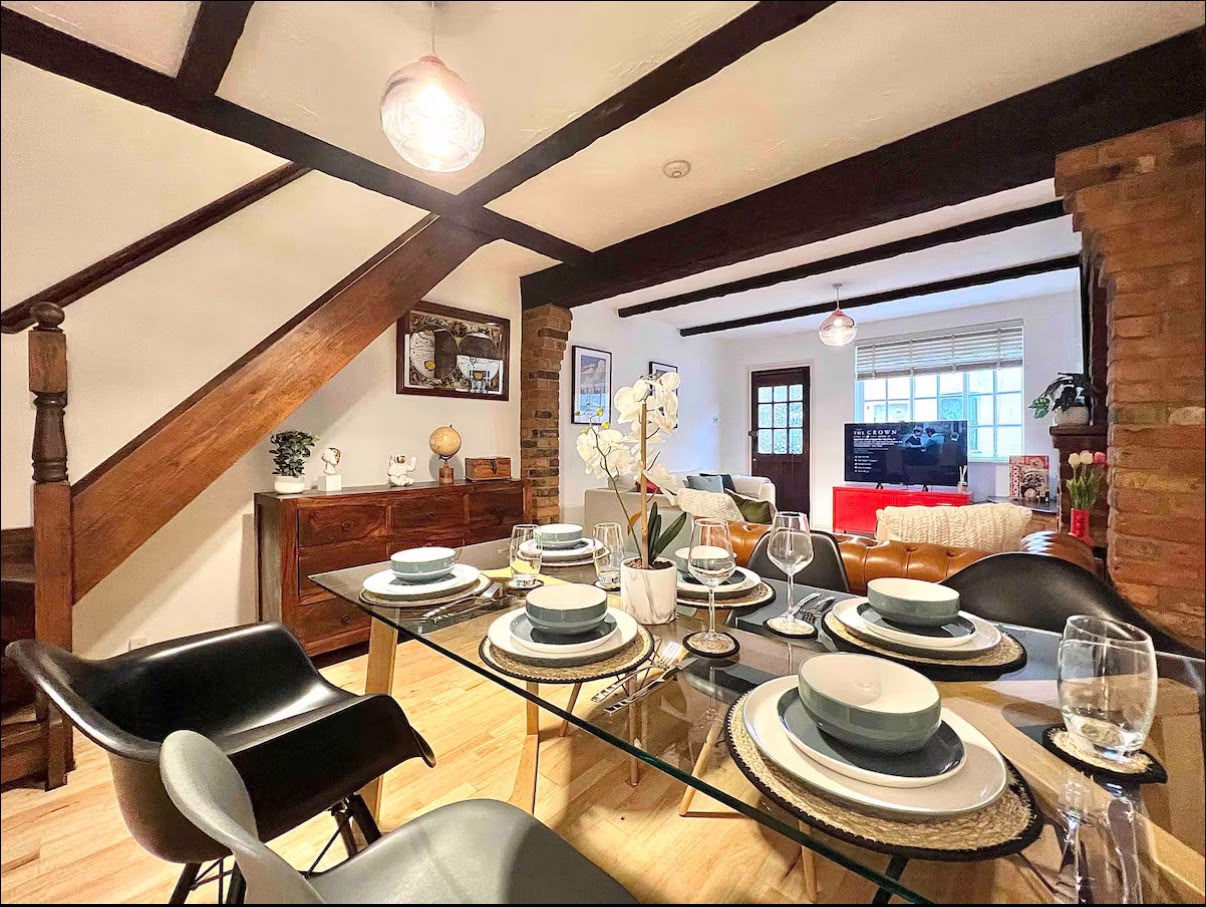 Dining area with glass table and designer chairs